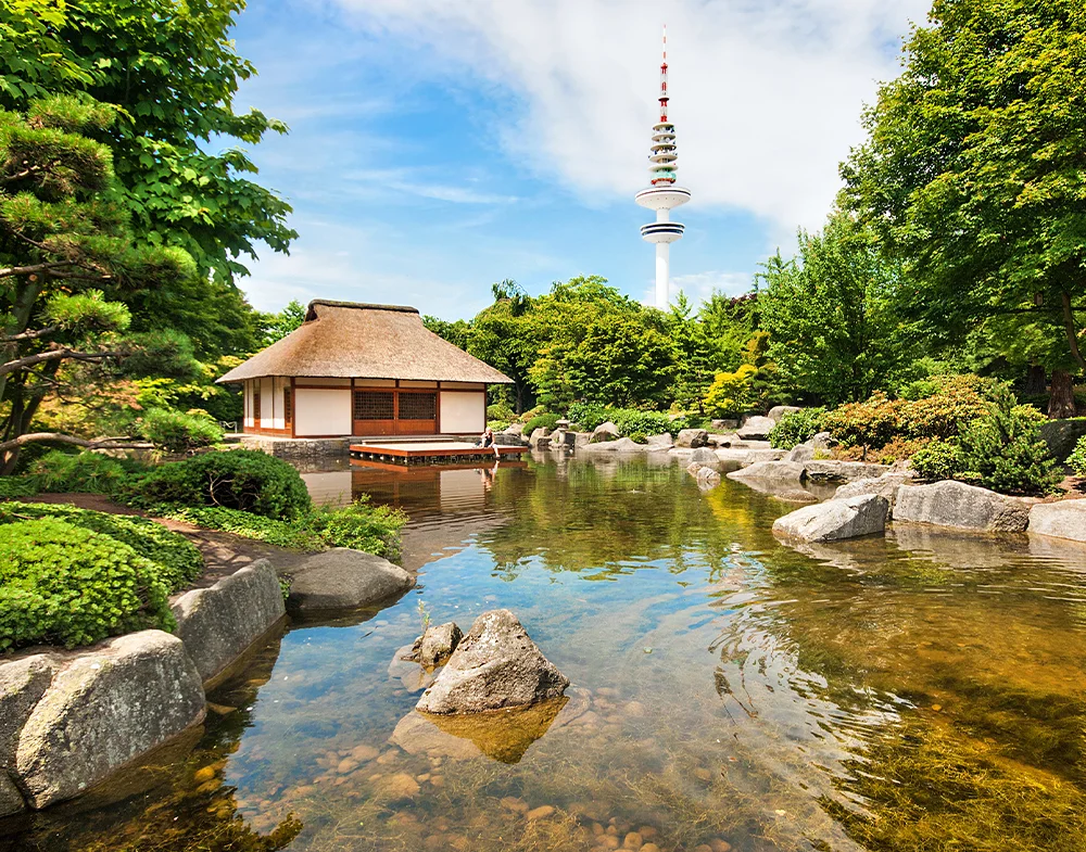Japanese Garden in Planten un Blomen with tea house, pond and Hamburg’s television tower