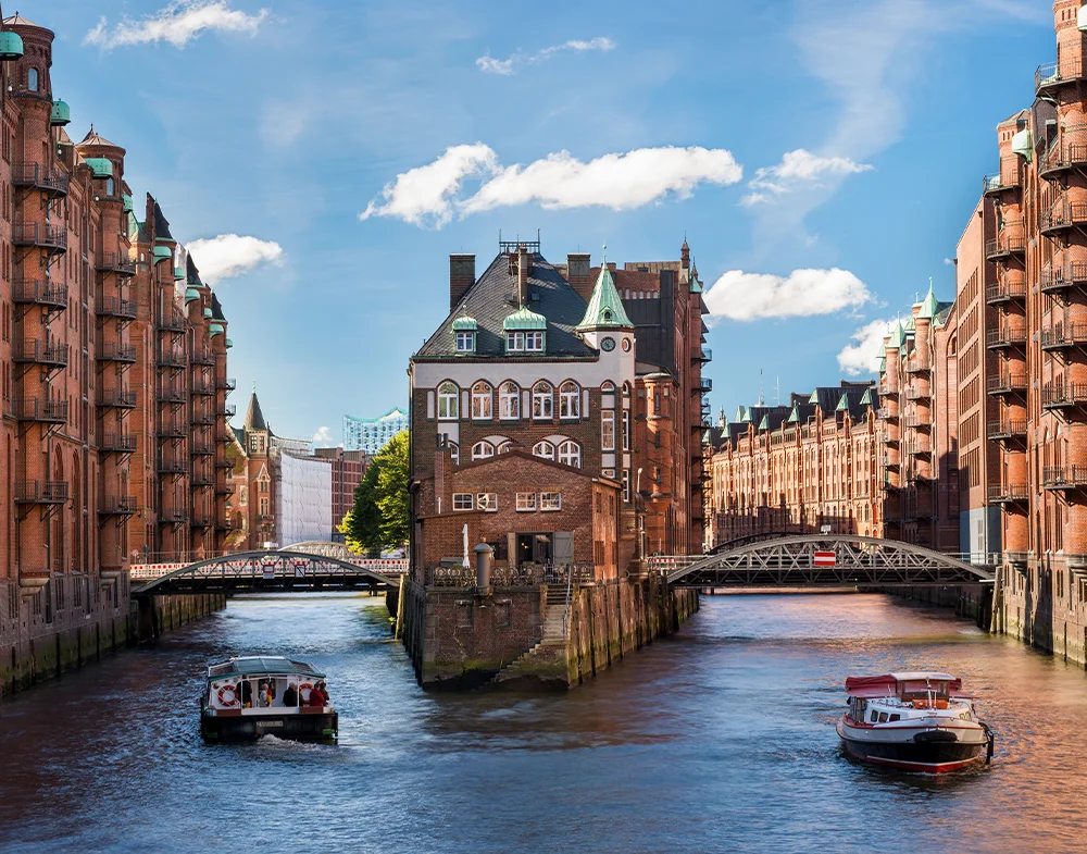 Red-brick warehouses, canals and sightseeing boats in Hamburg’s Speicherstadt